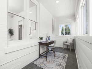 Carpeted home office featuring recessed lighting and wooden ceiling
