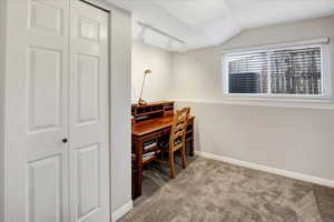 Home office with carpet and rail lighting