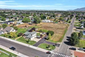 Aerial view of property's location featuring nearby suburban area and a mountainous background