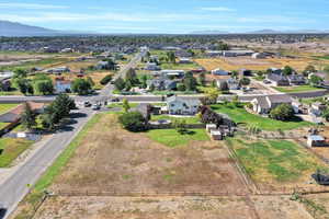Aerial perspective of suburban area featuring a mountain backdrop