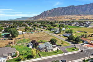 Aerial perspective of suburban area with a mountain backdrop