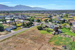 Aerial perspective of suburban area with a mountainous background