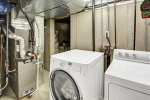 Laundry area featuring independent washer and dryer