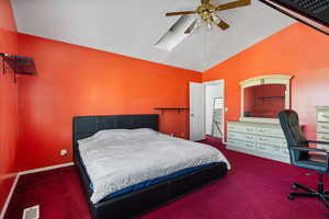 Bedroom featuring lofted ceiling, carpet floors, and ceiling fan