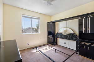 Unfurnished bedroom featuring carpet and a textured ceiling