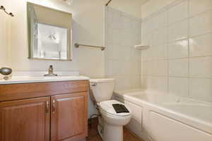 Full bathroom featuring vanity, tile patterned floors, and  shower combination