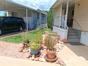 View of property exterior with an attached carport