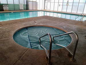 Indoor pool with a community hot tub