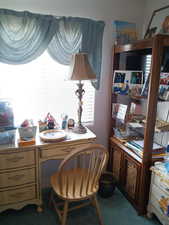 Home office featuring carpet