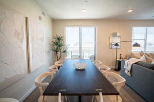 Dining area featuring wood finished floors and recessed lighting