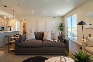 Living area with recessed lighting and wood finished floors