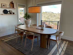 Dining area with hardwood / wood-style floors and baseboards