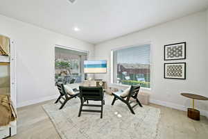 Dining room featuring light wood-style flooring, a textured ceiling, and recessed lighting