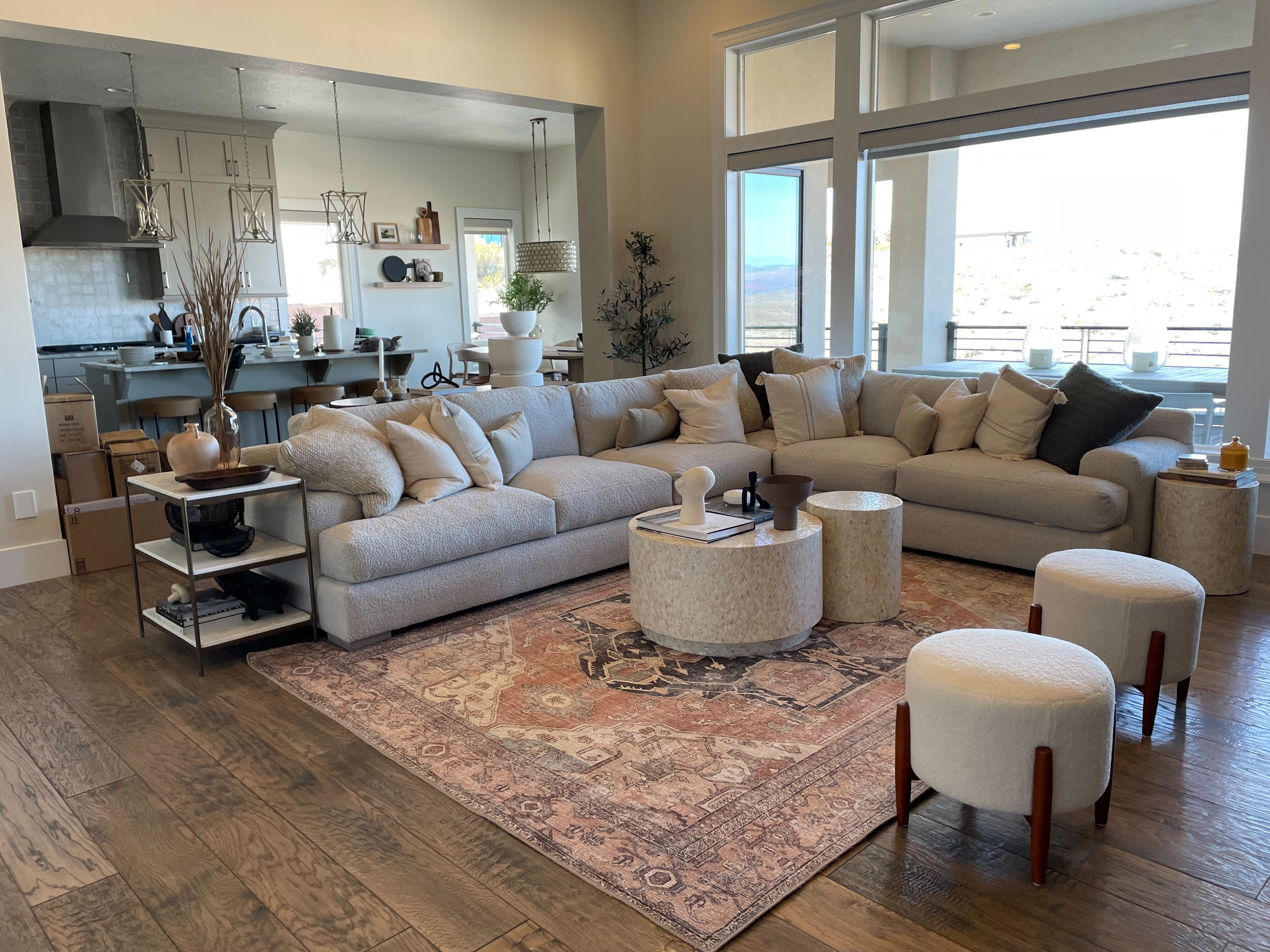 Living area featuring dark wood-style flooring and a chandelier
