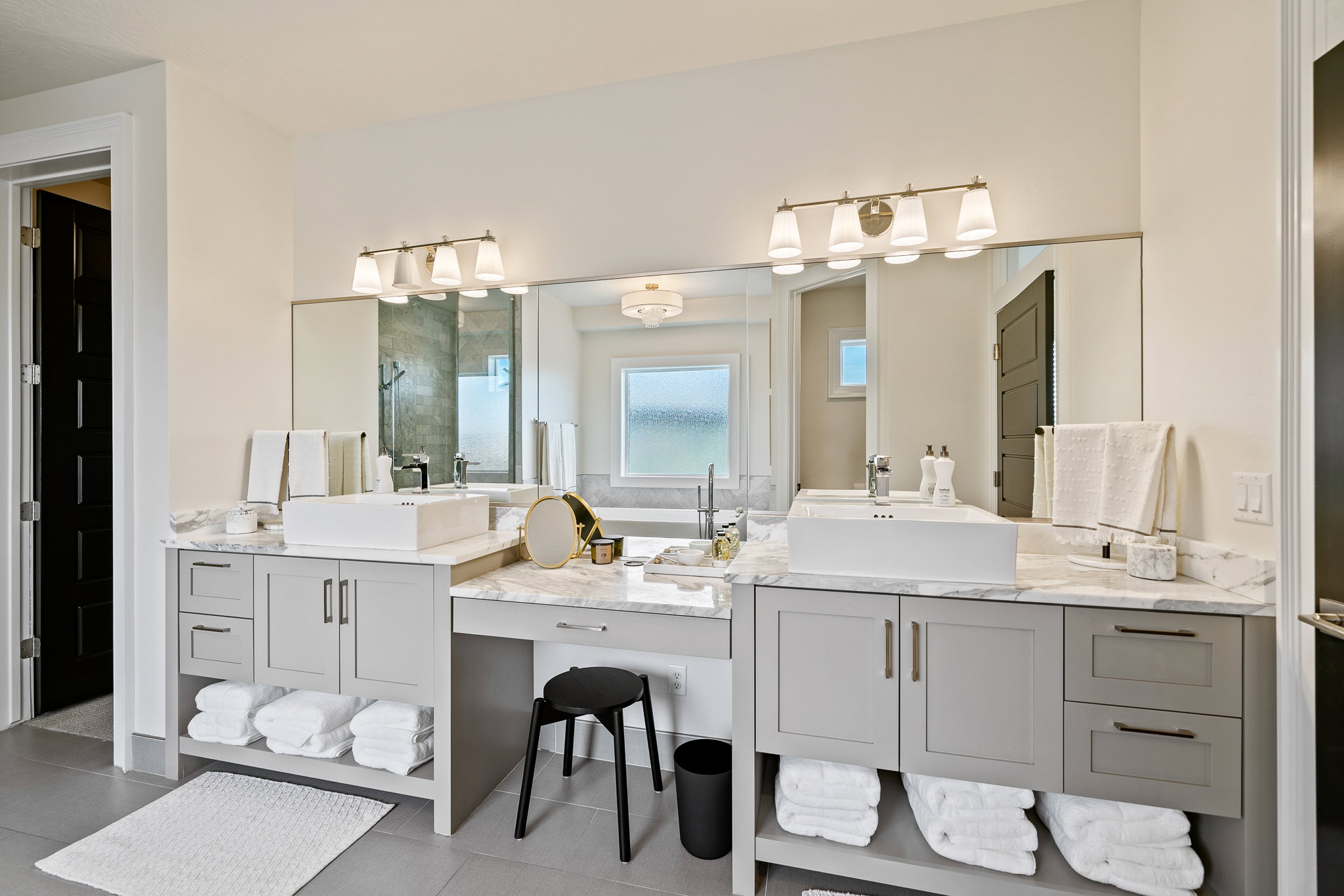 Bathroom featuring a stall shower, tile patterned floors, and vanity