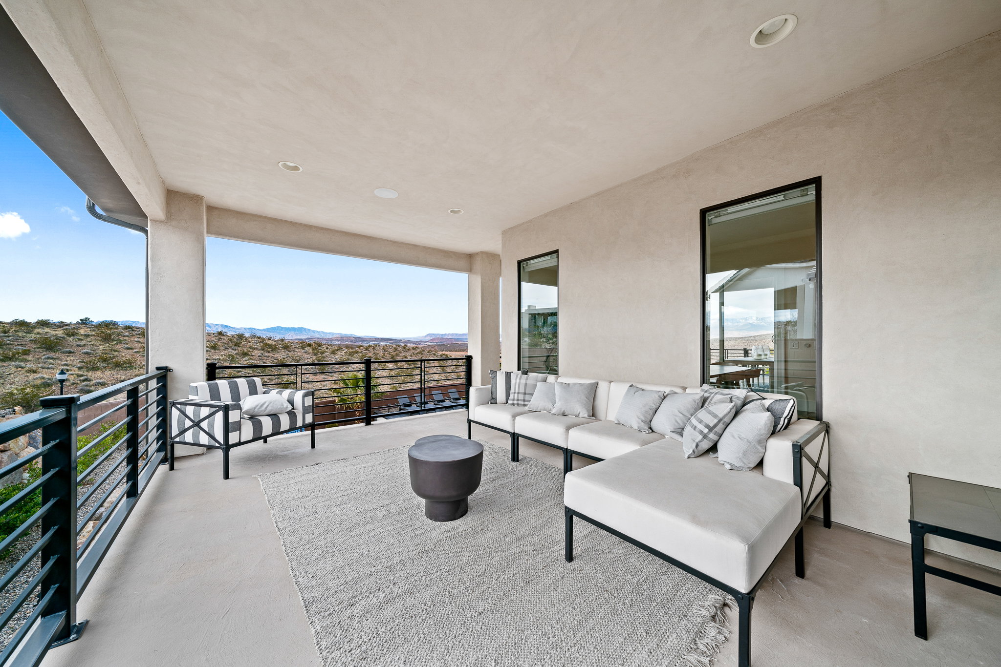 Patio / terrace with an outdoor hangout area and a mountain view