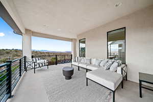 Patio / terrace with an outdoor hangout area and a mountain view