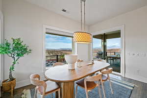 Dining space featuring a mountain view and hardwood / wood-style floors