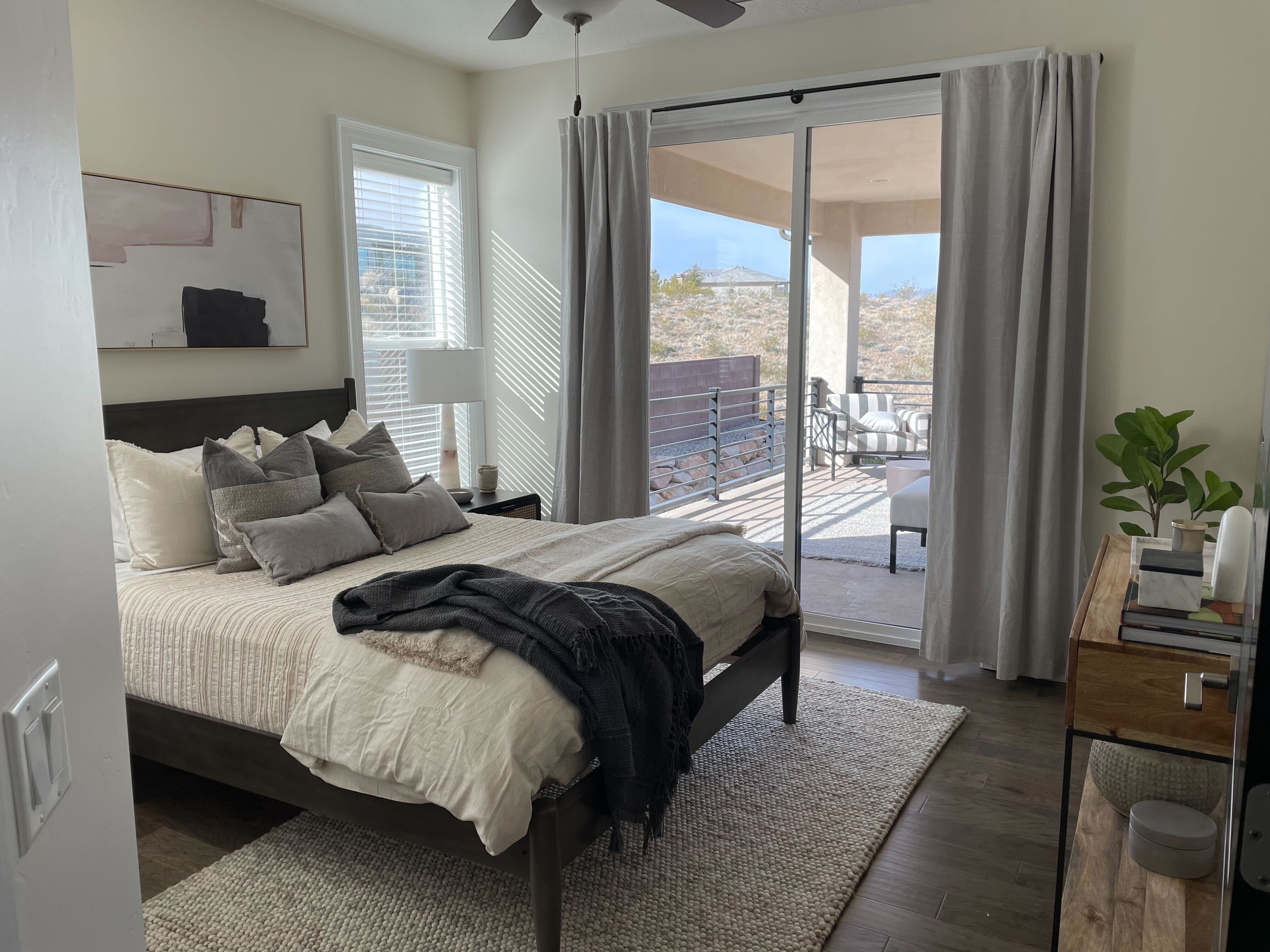 Bedroom with access to outside, dark wood-type flooring, and a ceiling fan