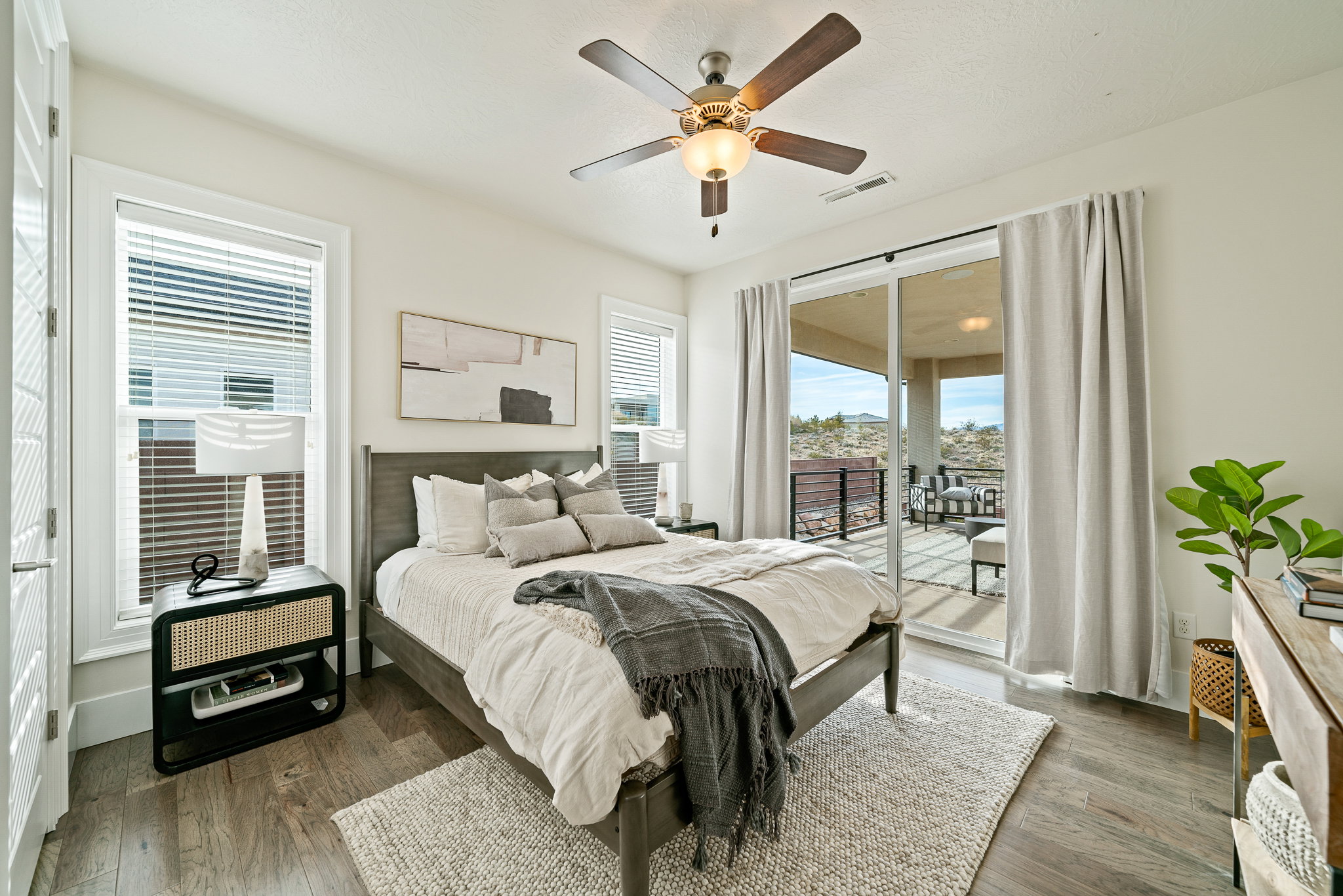 Bedroom with access to outside, wood finished floors, and ceiling fan