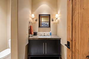 Half bath with vanity and toilet