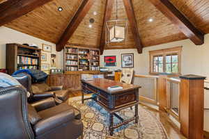 Office with wood ceiling and wood finished floors