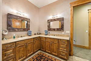Full bathroom featuring double vanity