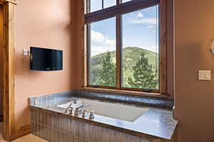 Full bath featuring a garden tub