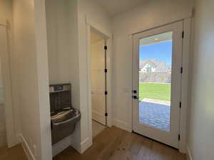 Entryway with wood finished floors and baseboards