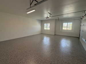 Garage featuring baseboards