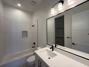 Full bath with vanity and tub / shower combination