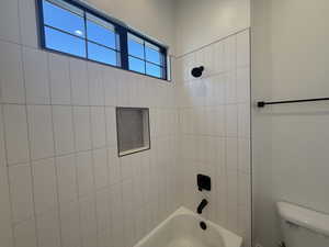 Bathroom with toilet and shower / tub combination