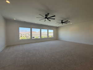 Unfurnished room featuring light carpet, recessed lighting, and ceiling fan