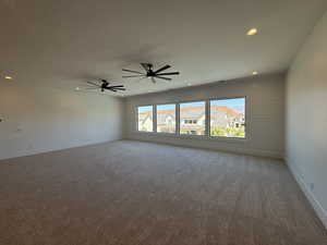 Unfurnished room featuring carpet floors, recessed lighting, and a ceiling fan