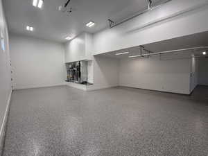 Garage featuring baseboards