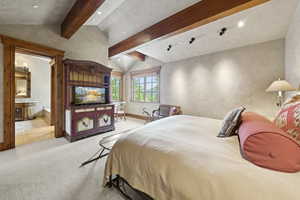 Carpeted bedroom featuring recessed lighting and connected bathroom