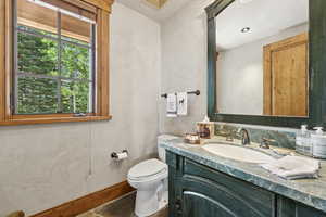 Bathroom featuring vanity and toilet