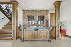 Indoor wet bar featuring stairway, recessed lighting, and carpet floors