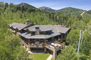 View from above of property with a mountain backdrop