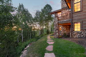 View of green lawn with a balcony