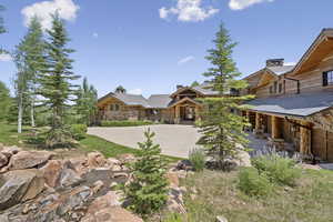 View of yard featuring concrete driveway