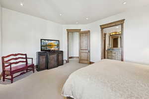 Bedroom with recessed lighting and light colored carpet