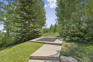 View of property's community with a yard