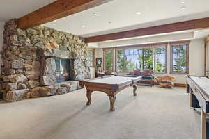 Recreation room with beamed ceiling, billiards, carpet flooring, recessed lighting, and a fireplace