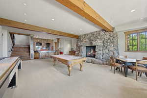Rec room featuring beamed ceiling, pool table, recessed lighting, carpet floors, and a fireplace