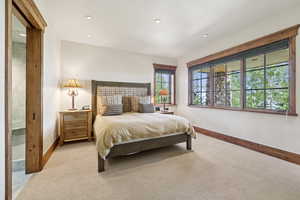 Bedroom with recessed lighting and light colored carpet