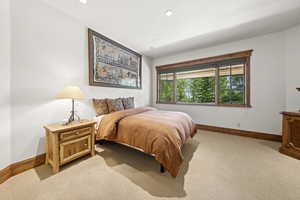 Carpeted bedroom featuring recessed lighting
