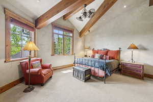 Bedroom with carpet floors and baseboards