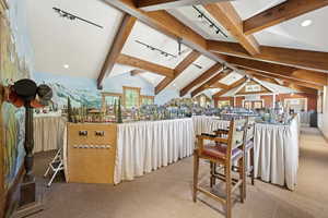 Dining space featuring carpet, rail lighting, and recessed lighting