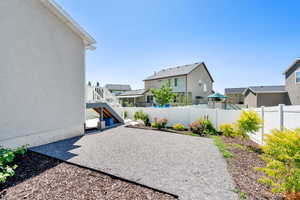 View of yard with a residential view, a patio, and stairway